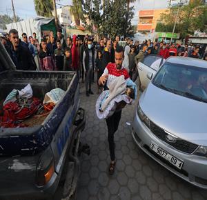 Slain and injured Palestinians transferred to hospitals after the occupation aircraft bombed homes in Gaza's Deir al-Balah.