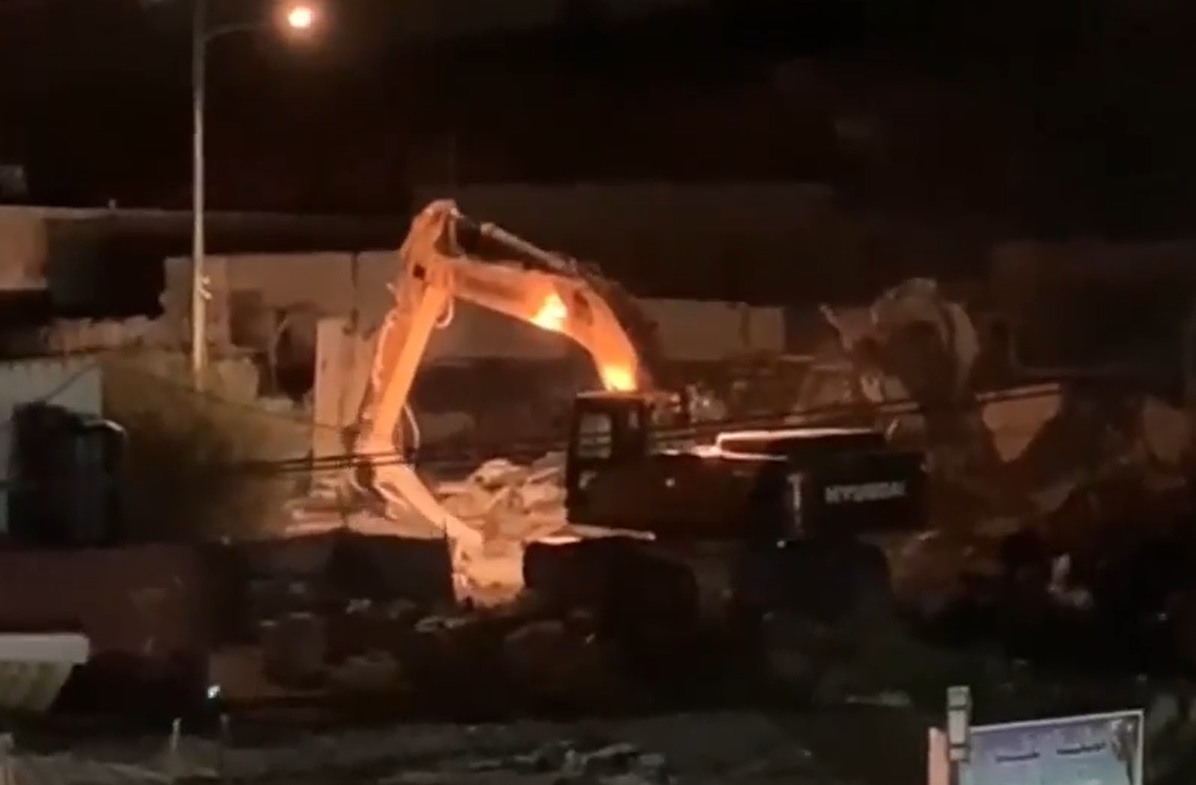 Israeli forces demolish Palestinian-owned shops in the town of Hizma, east of Jerusalem