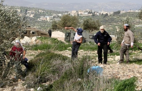 Israeli settlers close road in northern West Bank, attack Palestinian vehicles