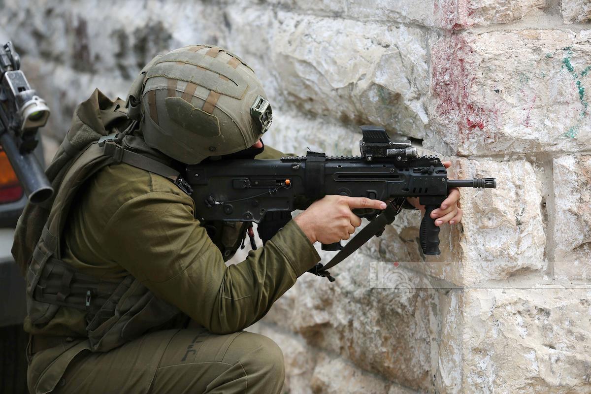 Palestinian youth injured by a live bullet fired by Israeli soldiers during an assault on Nablus