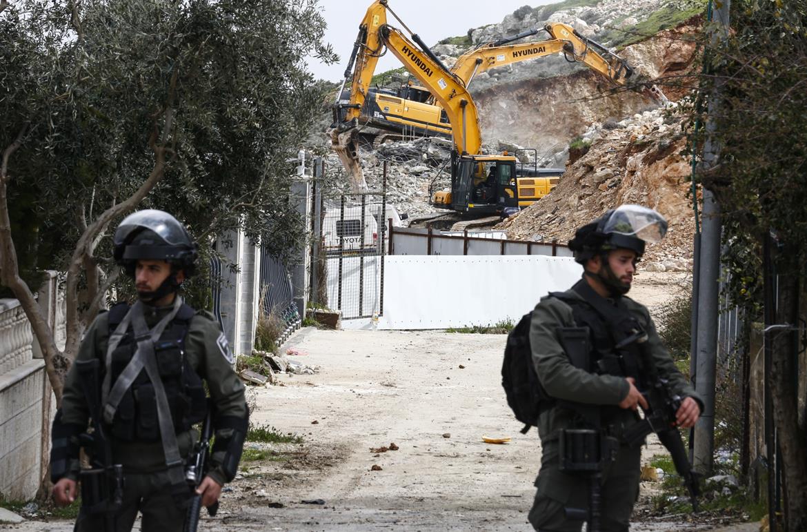 Israeli occupation authorities demolish Palestinian-owned two-story building in West Bank city