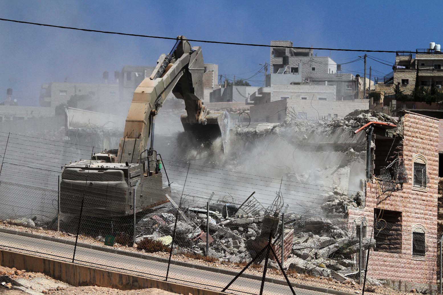 Israeli occupation demolishes residential building in Jerusalem