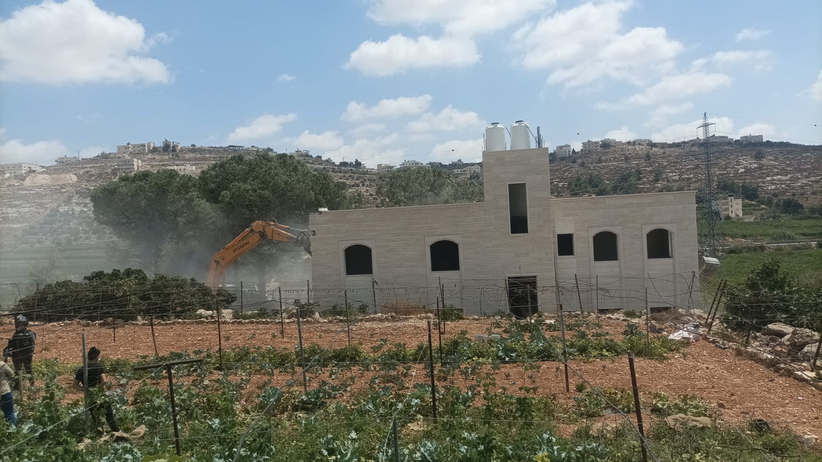 Two-story house demolished east of Hebron city