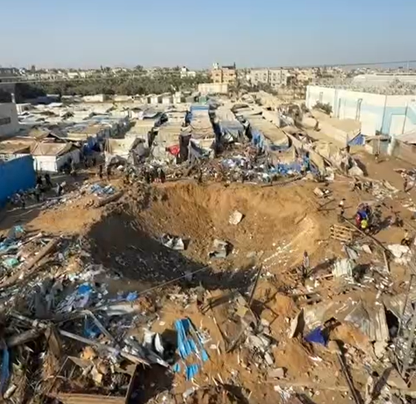 A large crater caused by an Israeli strike on a medicines and medical supplies warehouse belonging to Al-Aqsa Martyrs Hospital in Deir al-Balah, central Gaza Strip.