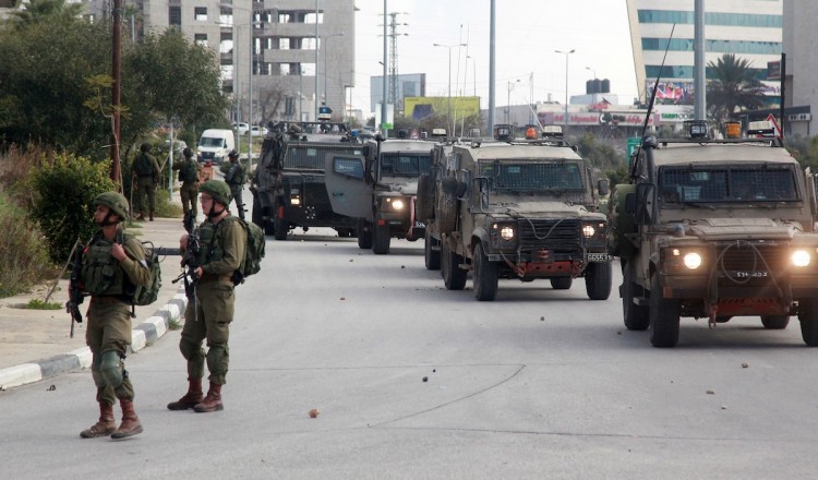 Occupation forces detain eight Palestinians, injure two during raids in West Bank