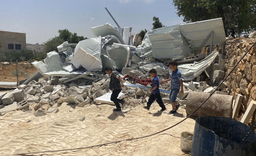 Israeli forces raze house, assault its occupants east of Hebron