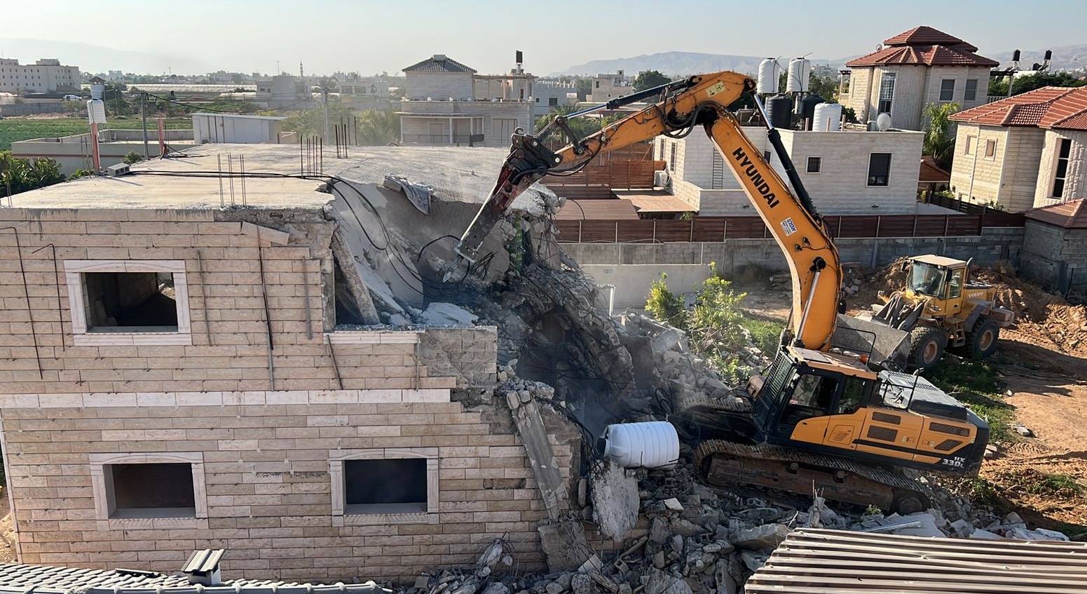 Israeli force demolish two Palestinian houses, walls near Jericho
