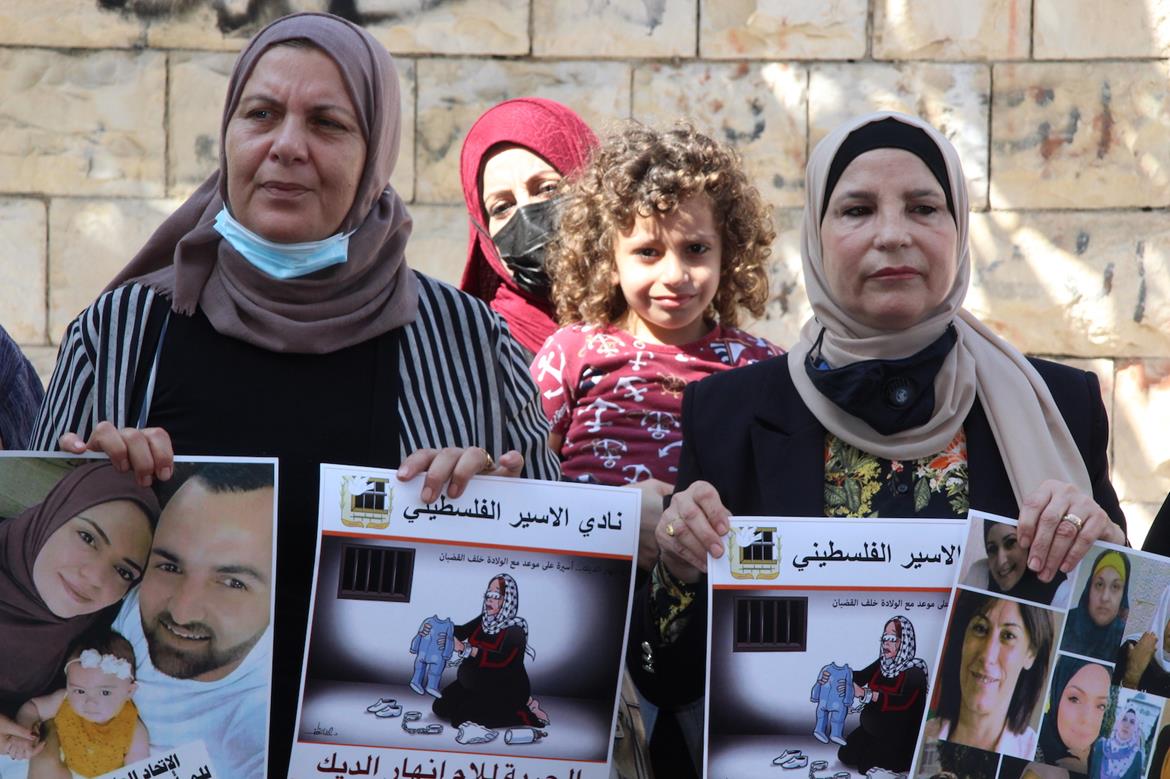 Palestinians rally at Red Cross in Ramallah in support of pregnant detainee in Israel, demand her release