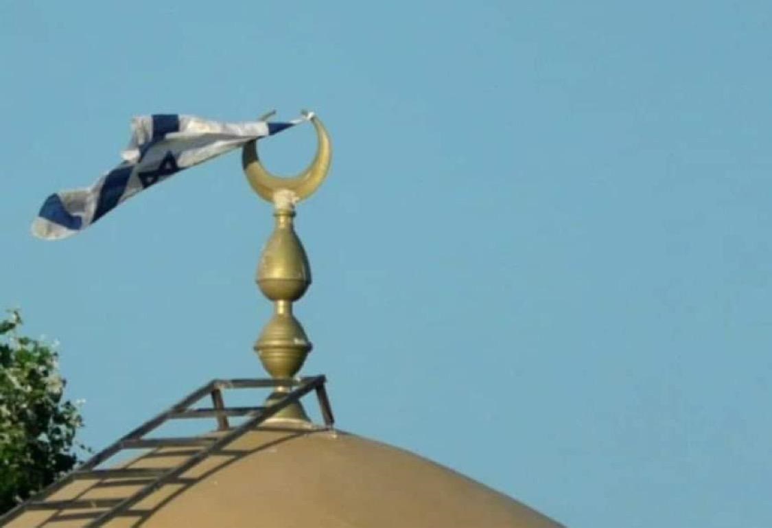 Israeli settlers hoist Israel flag atop mosque in Bethlehem-district village