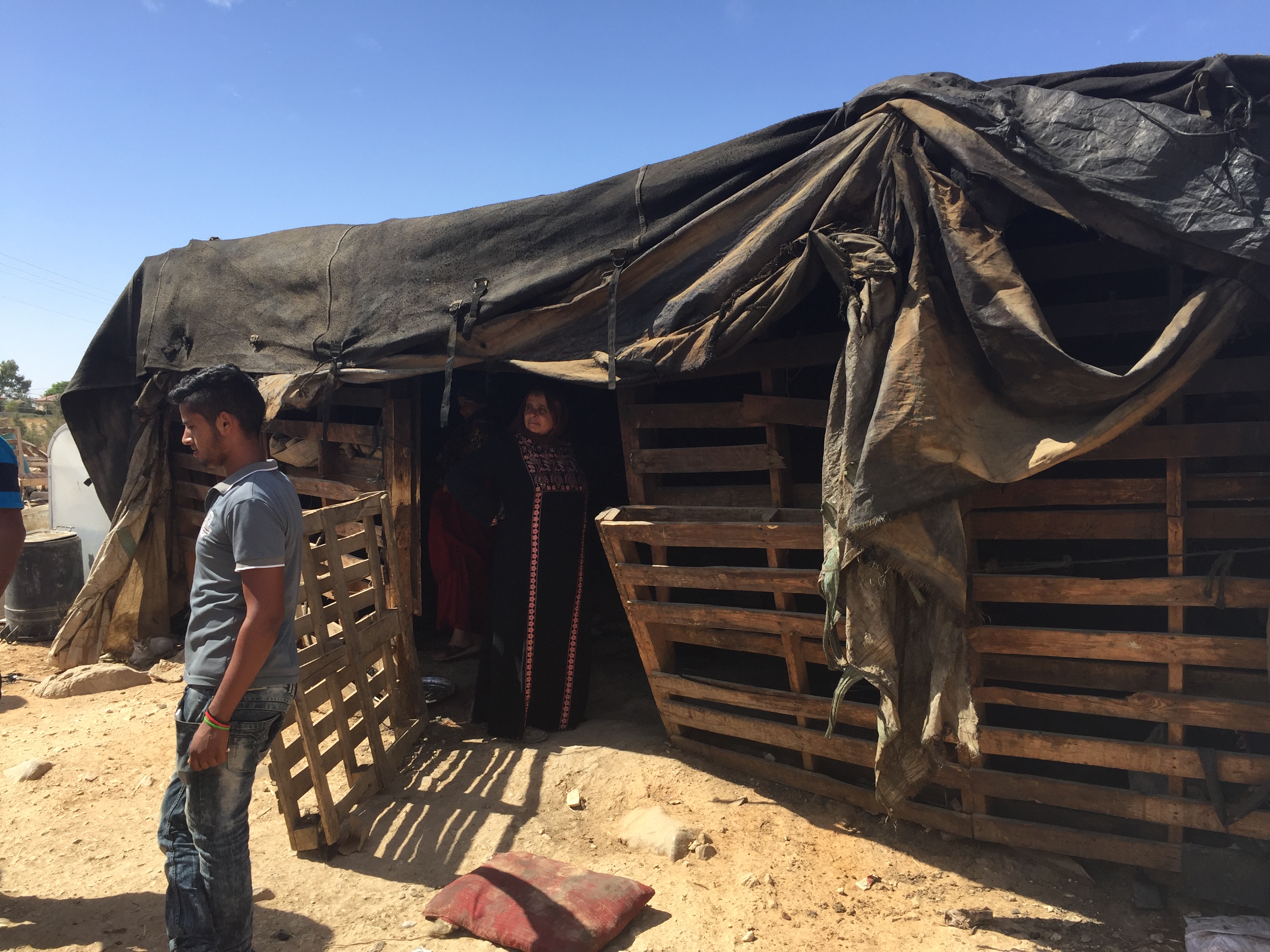Palestinian forced by Israeli occupation soldiers to remove tent he used to shelter his family of 13 people