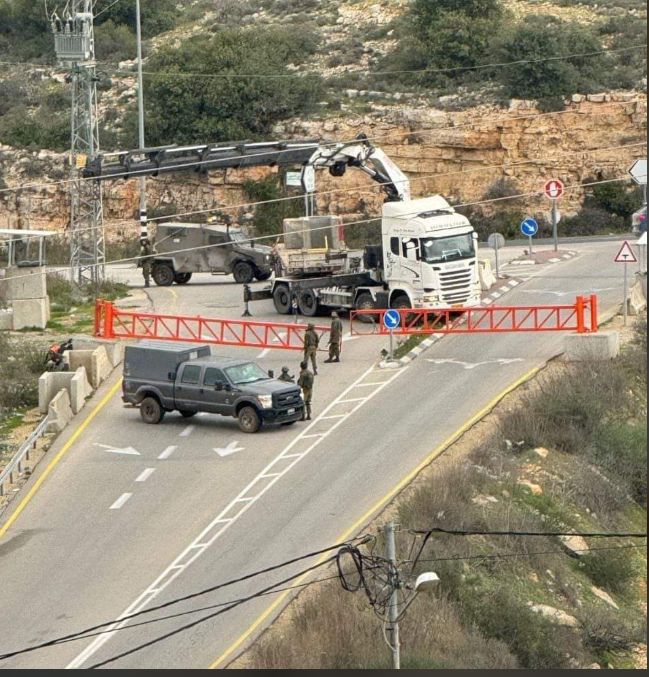 To restrict movement, Israel forces install iron gate at entrance to Ramallah-area town
