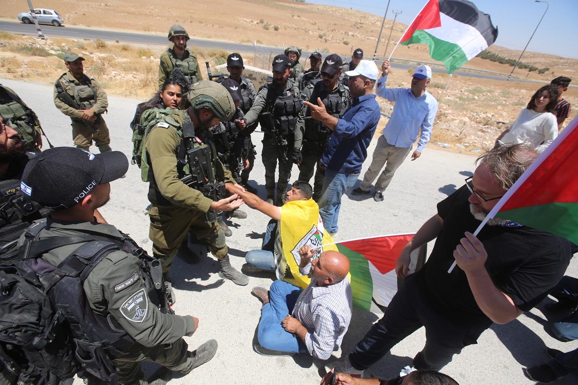 Dozens of Palestinians injured as Israeli soldiers attack a sit-in protest in the south of the West Bank