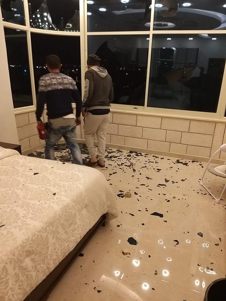 In a fresh attack, settlers pelt a house with stones in Huwwara
