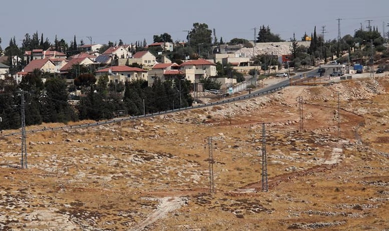Israeli settlers set up utility poles near Bethlehem 