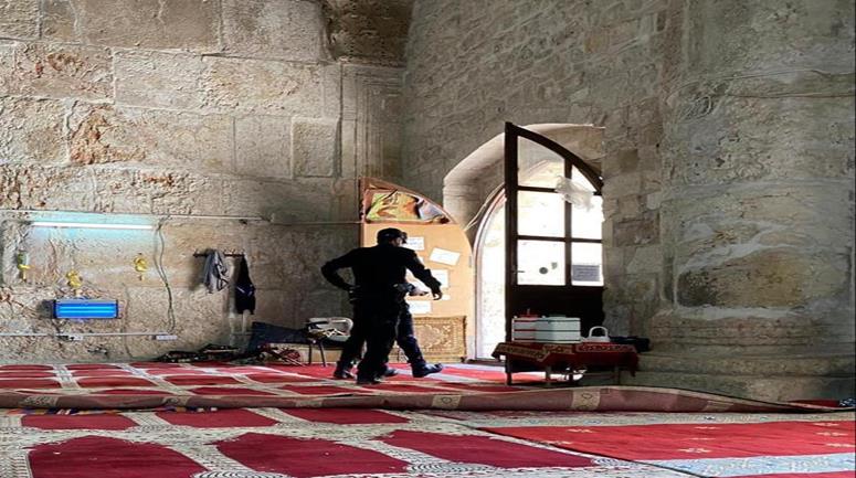As 100,000 Muslims attend the Eid morning prayer at Al-Aqsa, Israeli police raid the holy compound