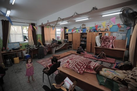 As 70,000 displaced people seek shelter in UNRWA’s Gaza facilities, a school receives a direct hit