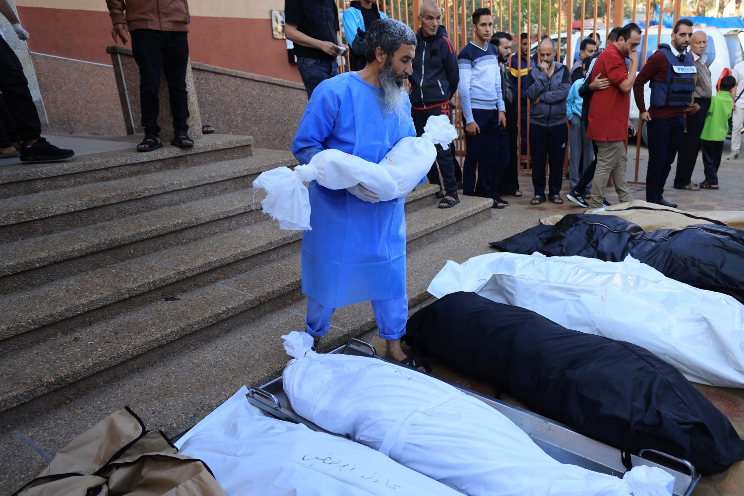 Medics retrieve bodies of 50 victims buried by Israeli army in mass grave in Khan Yunis