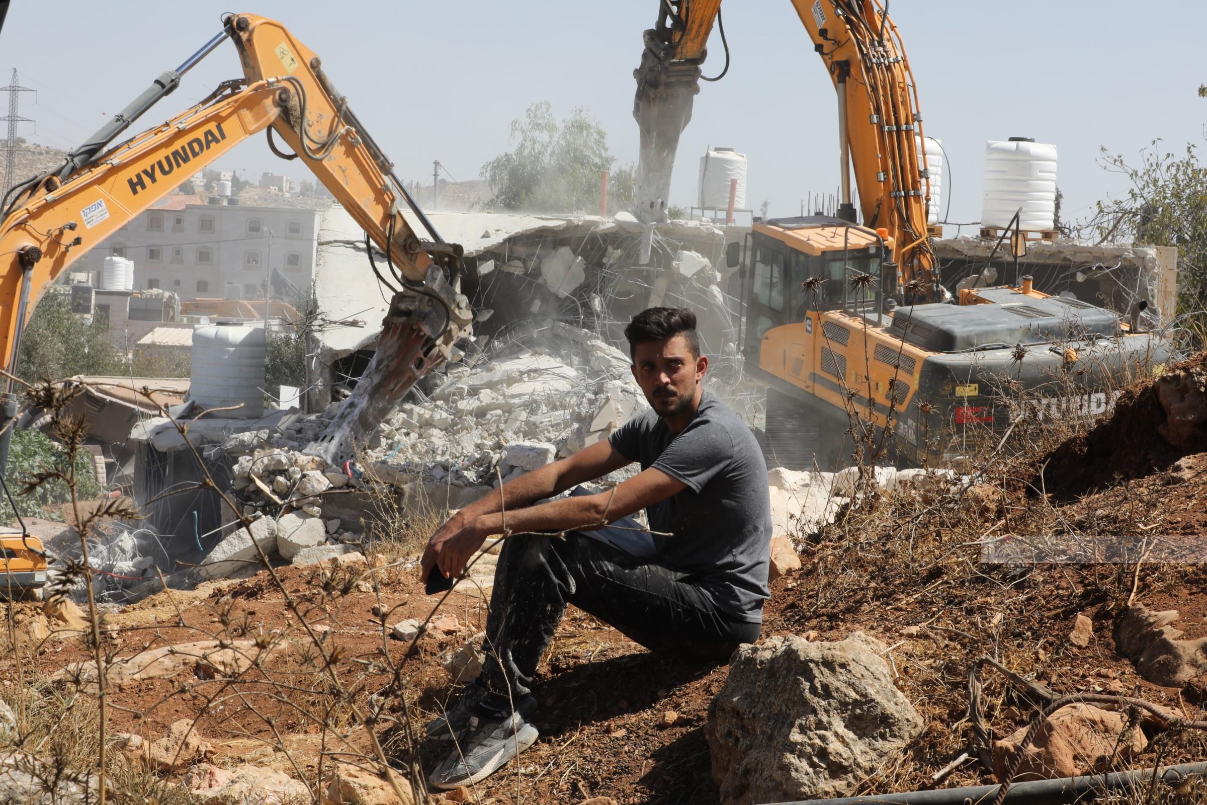 Israeli forces demolish structures near, raze lands Jerusalem