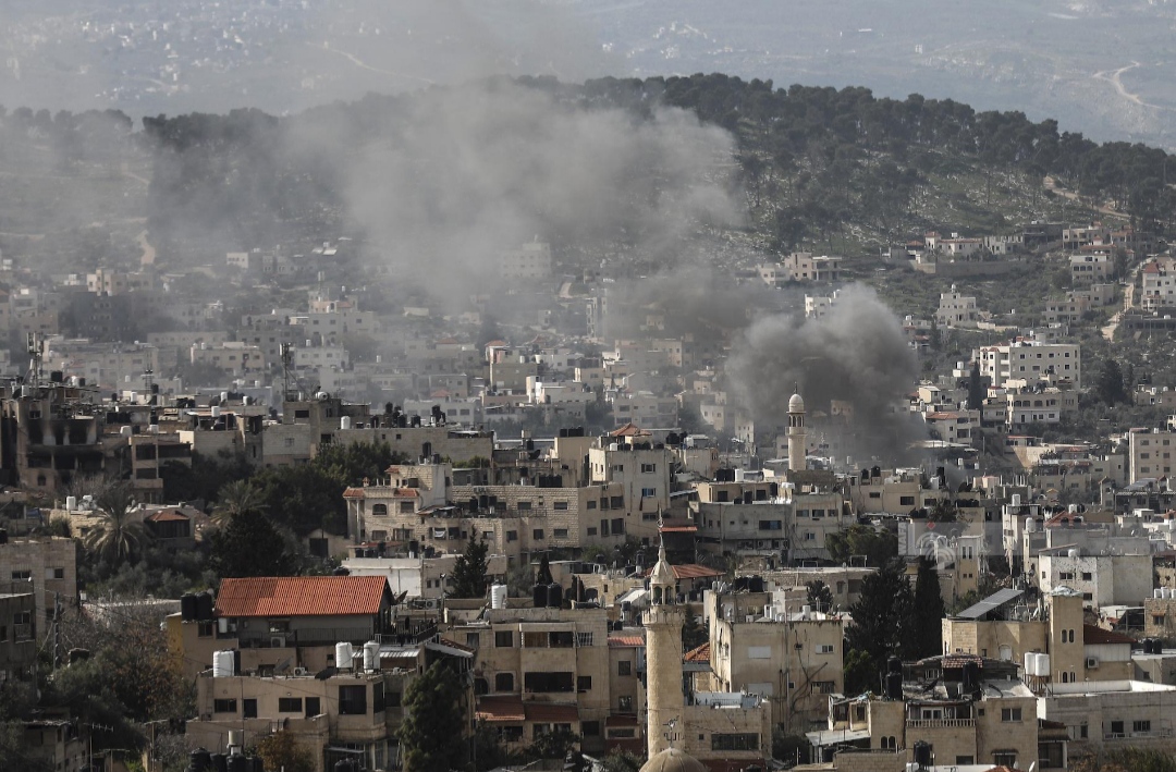 Israeli forces set fire to homes in Jenin refugee camp amid ongoing assault