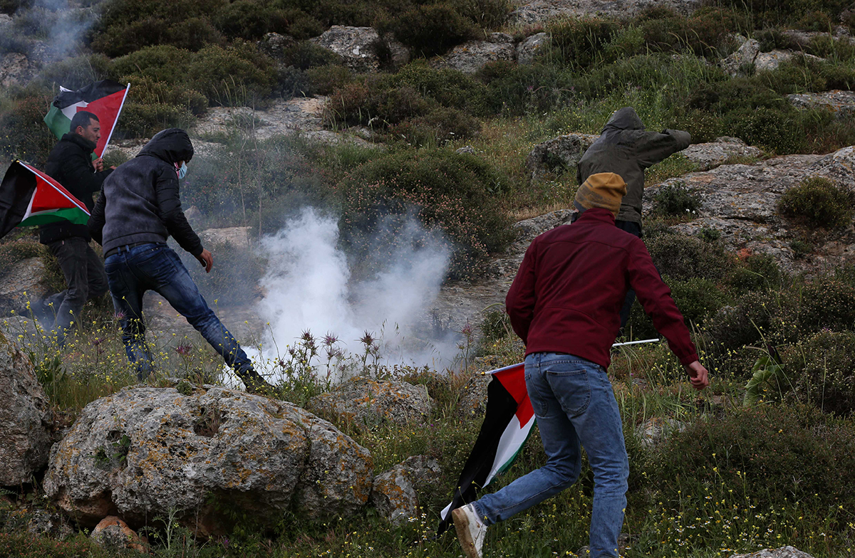 Israeli occupation forces attack Palestinians protesting 
settlement expansion in the south Hebron hills