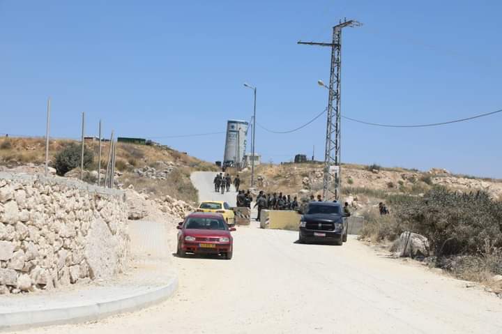 Settlers seeking to build a settlement outpost set up tents on Palestinian-owned land east of Hebron