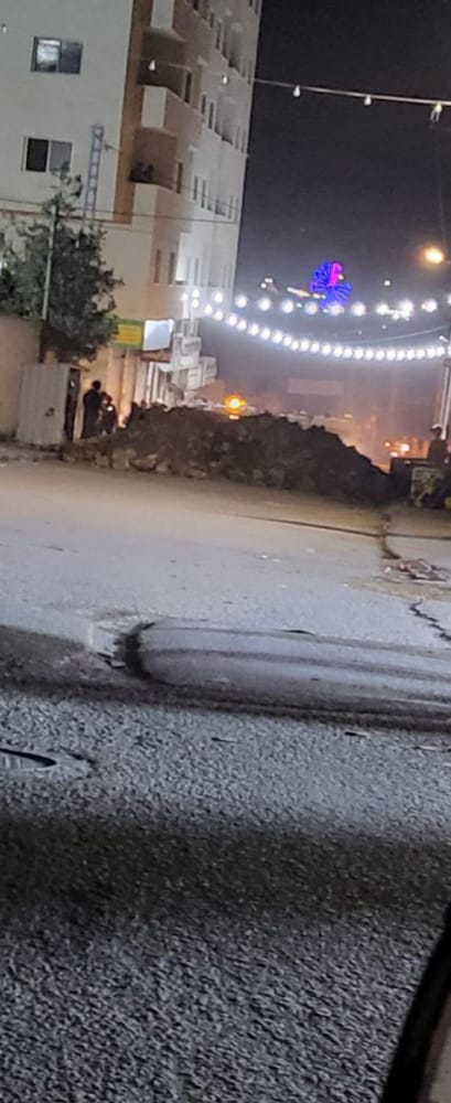 In punishment for hoisting Palestinian flags, Israel blocks all access roads except one to a West Bank town