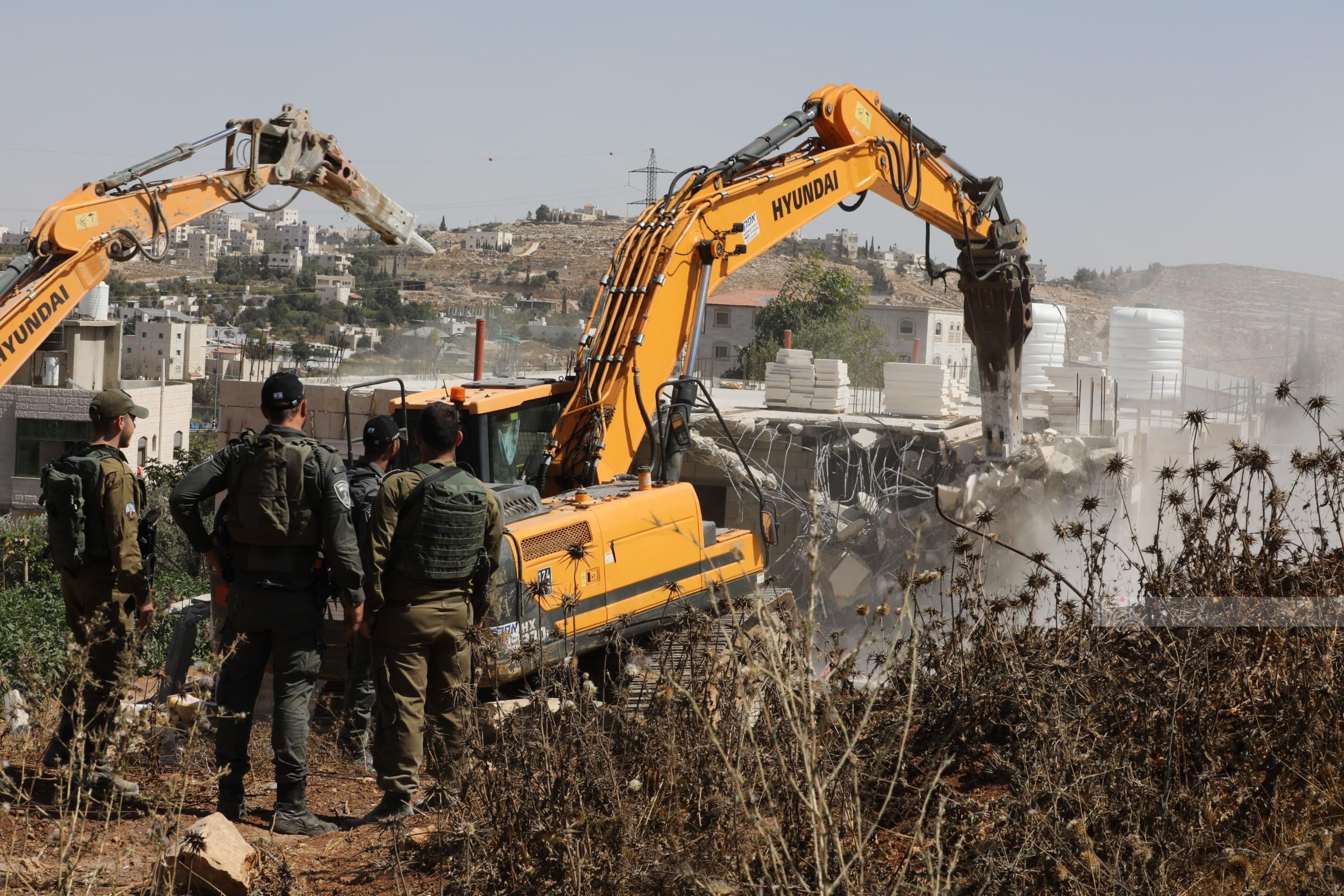 Israeli demolition of a two-floor Palestinian-owned house in Hebron district displaces 11 people
