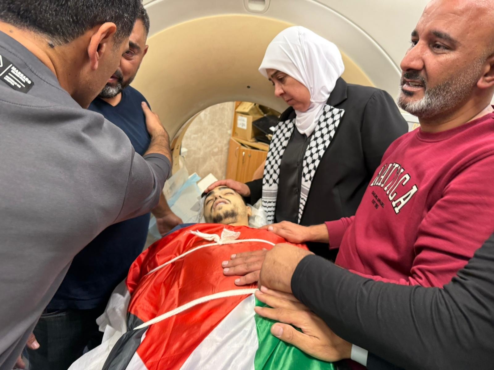Inside the Palestine Medical Complex: The body of Bara’ Khairy Ali Maali, 20, who was killed by Israeli forces'and colonists' live fire in Deir Jarir, east of Ramallah.
