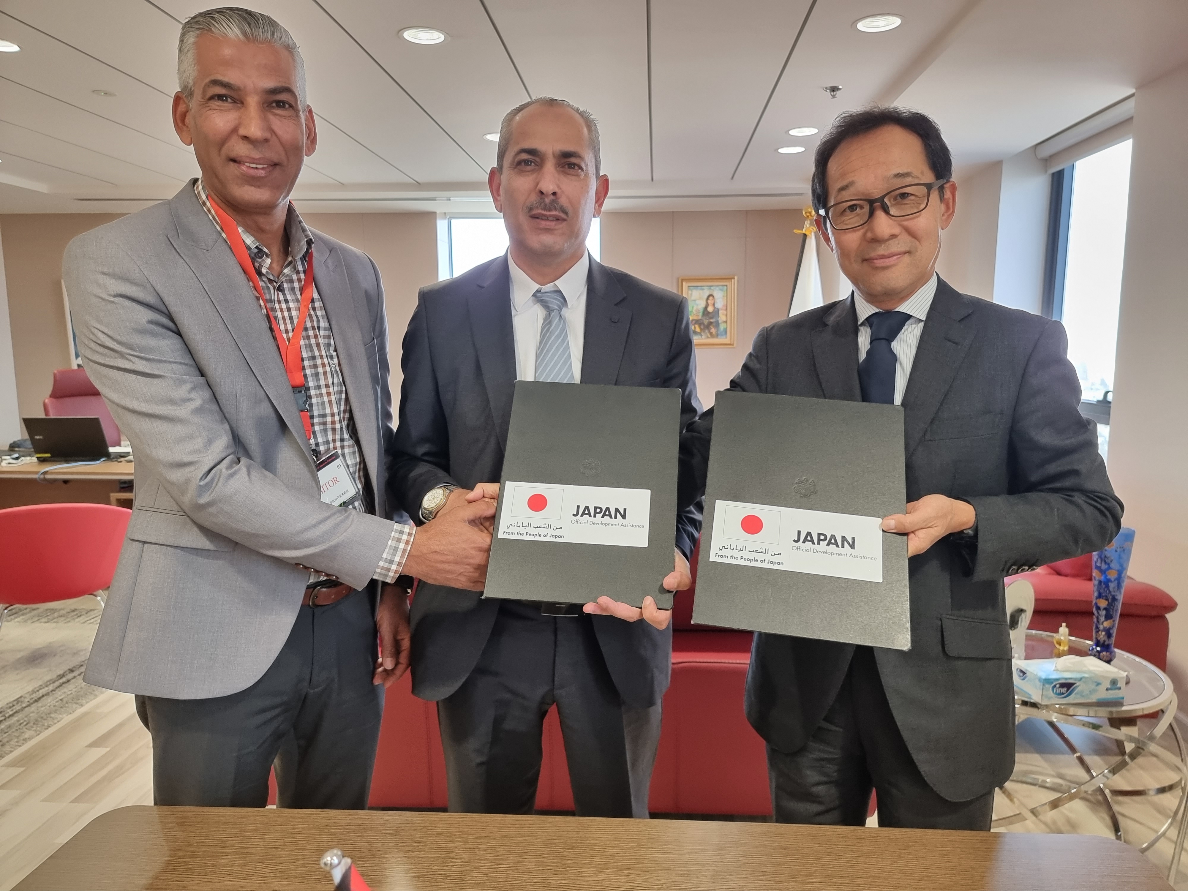 A grant signing ceremony with al-Khas village council funded by the Government of Japan