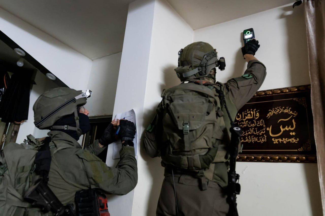 Israeli forces take measurements of family homes of alleged Palestinian assailants, an apparent prelude for punitive demolition