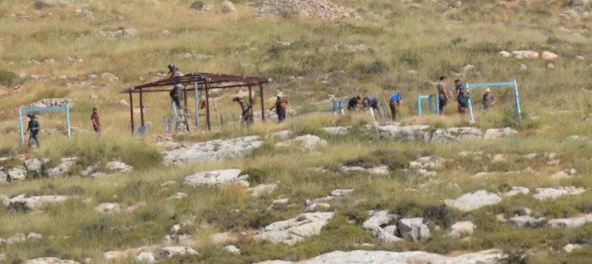 Israeli settlers set up wooden pergolas in northern Jordan Valley