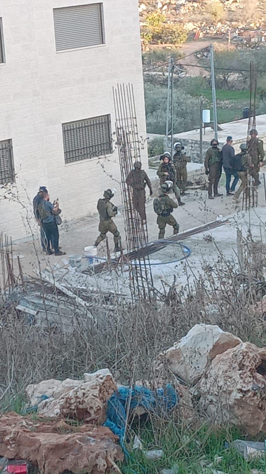 Israeli occupation forces raid several Palestinian homes, attack dwellers northwest of Jerusalem