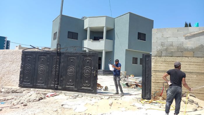 Several Palestinian residents of a West Bank town receive Israeli stop-work and construction orders