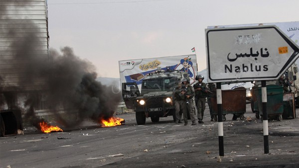 UPDATE: 10 Palestinians wounded by live bullets , another detained as Israeli forces raid of Nablus