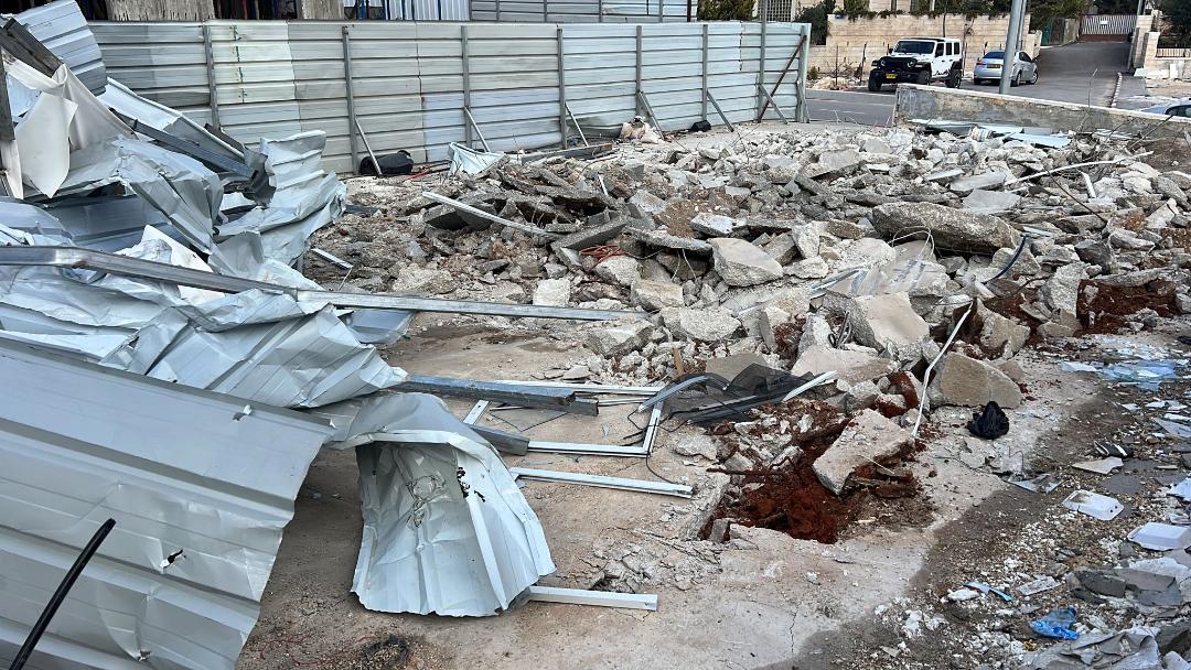 Israeli occupation forces demolish a car repair shop, raze roads in a northern West Bank village