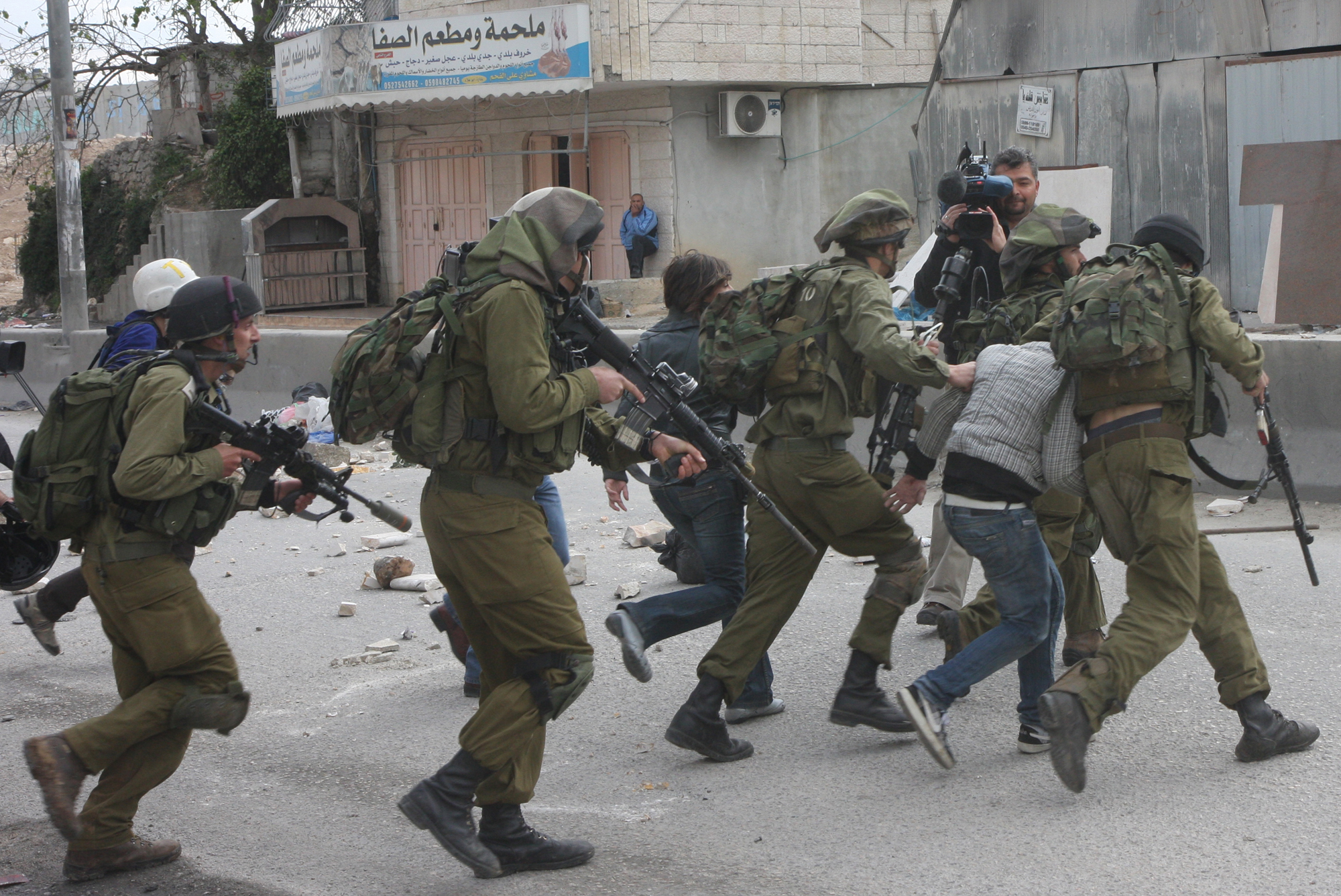 Israeli forces detain eight Palestinians in West Bank, youth in East Jerusalem 