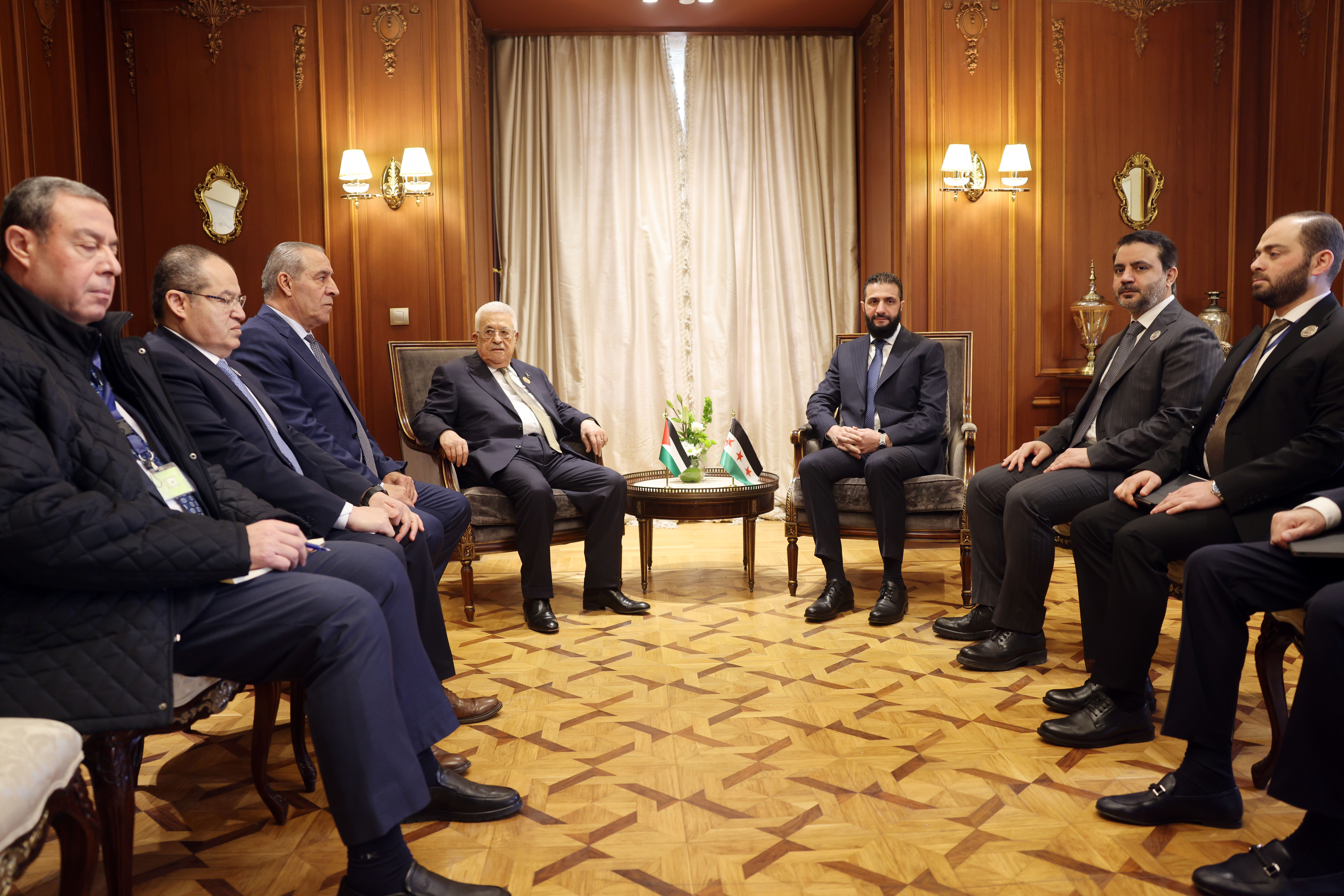 President Abbas meets with Syrian President on sidelines of emergency Arab Summit