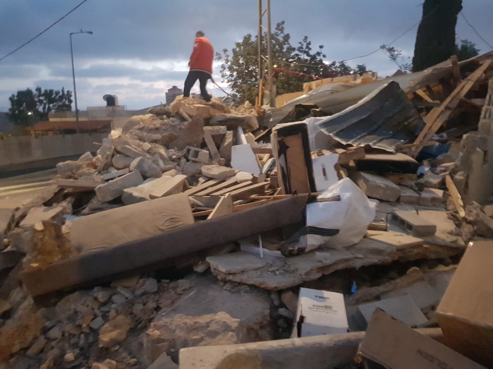 Israel demolishes house, stores in Jerusalem