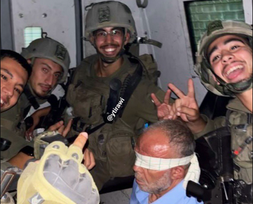 Israeli soldiers publish photos of elderly man being abused during detention 