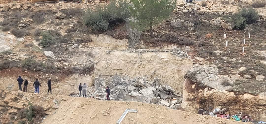 Israeli occupation forces demolish two-story house in West Bank town