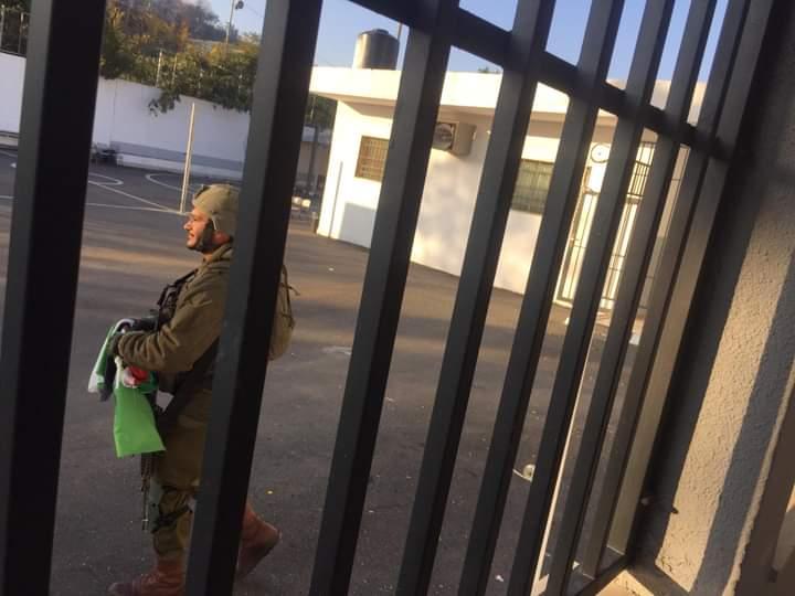 Israeli forces raid Palestinian girls' school, remove flag