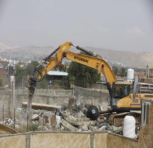 An Israeli bulldozer demolishing a house in the Jericho area. (WAFA Images / Suleiman Abu Srour)