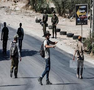 Colonists, accompanied by Israeli occupation forces, storm western and southern Nablus on Friday. (Photo: Mohammad Mansour)
